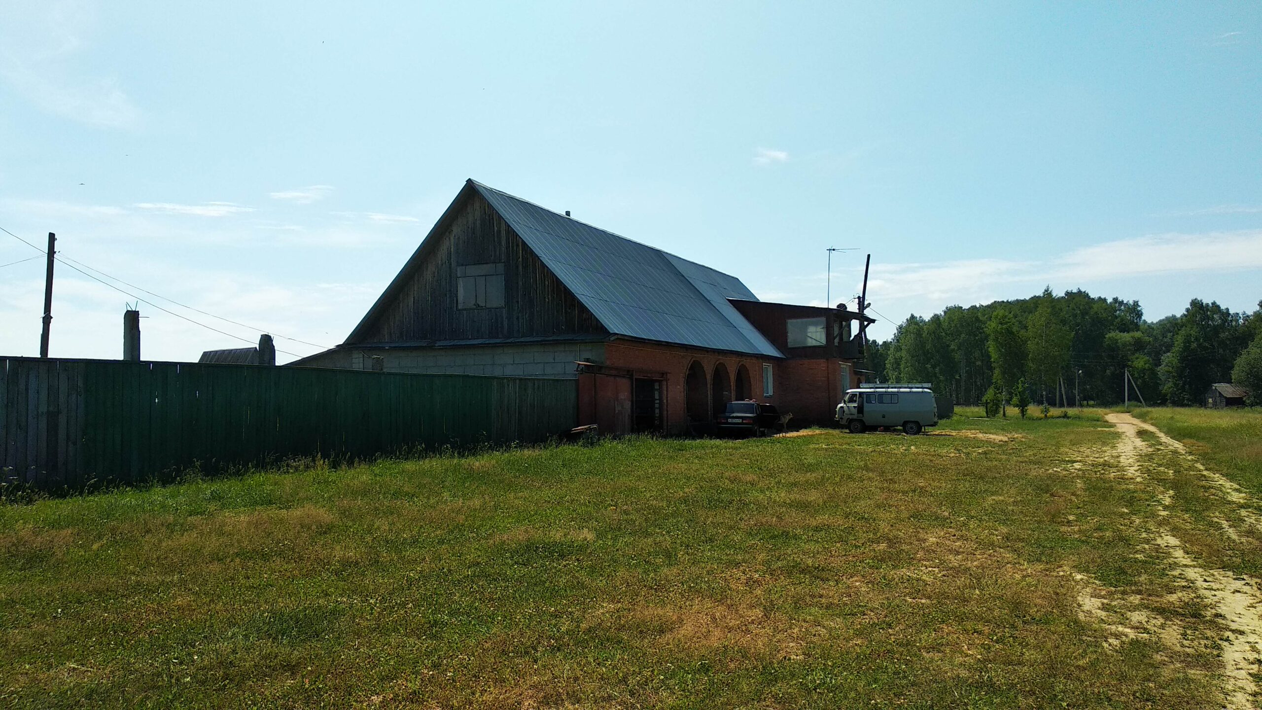 A house is for sale. A hangar, a plot of land for farming.