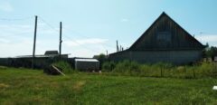 A house is for sale. A hangar, a plot of land for farming.