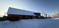 A house is for sale. A hangar, a plot of land for farming.