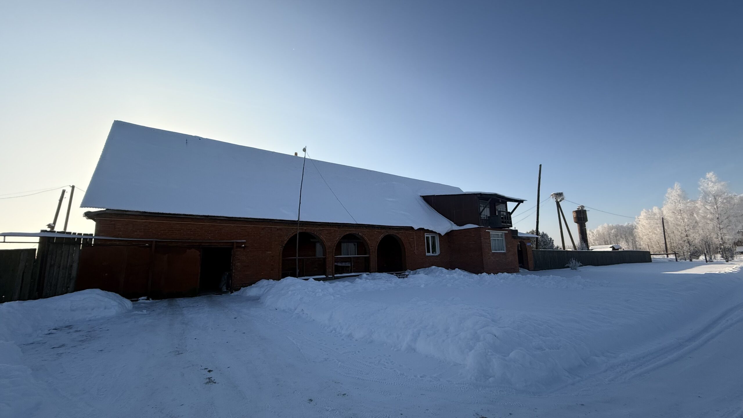 A house is for sale. A hangar, a plot of land for farming.