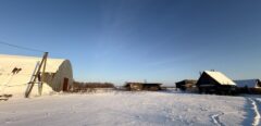 A house is for sale. A hangar, a plot of land for farming.