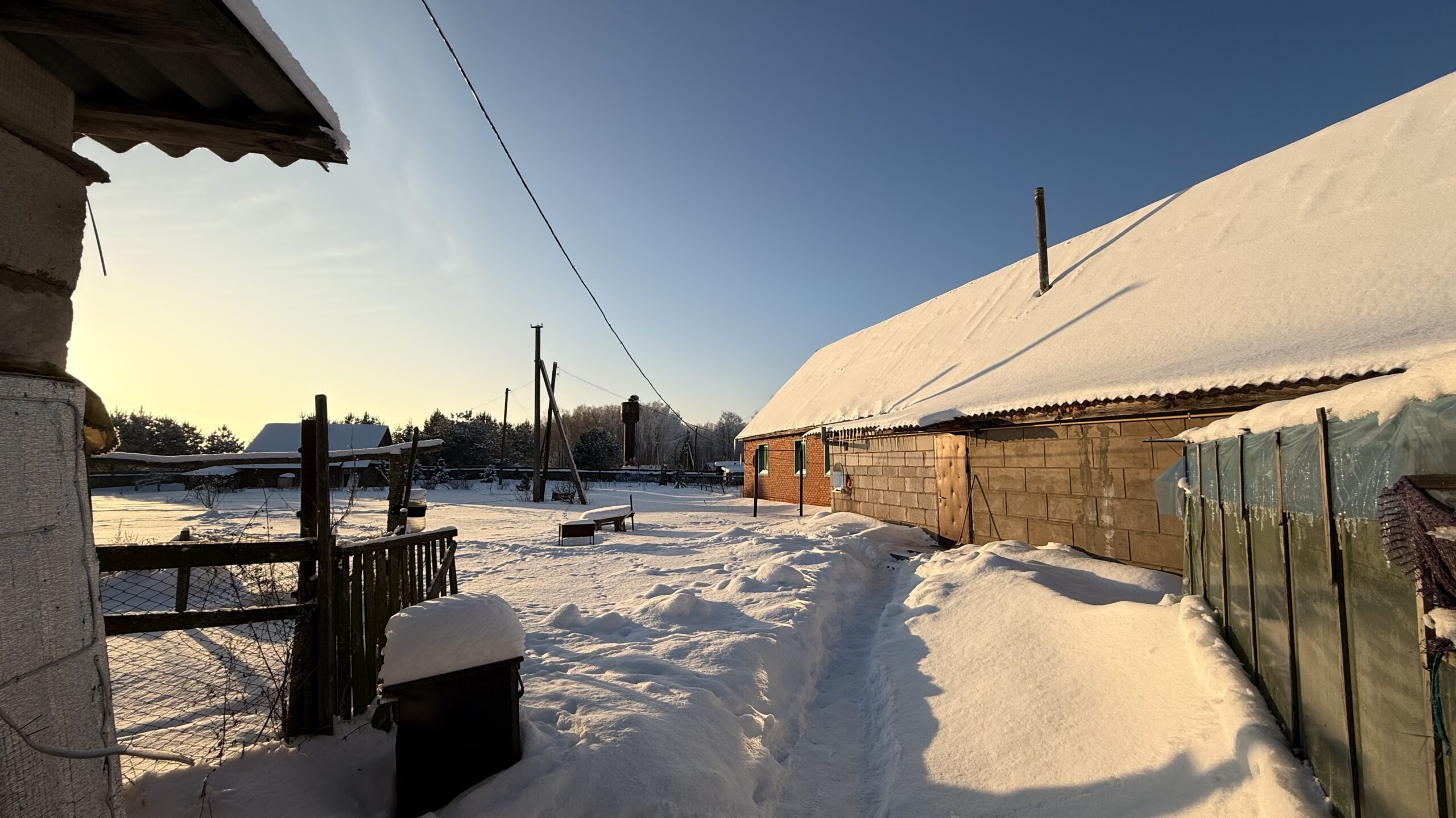 A house is for sale. A hangar, a plot of land for farming.